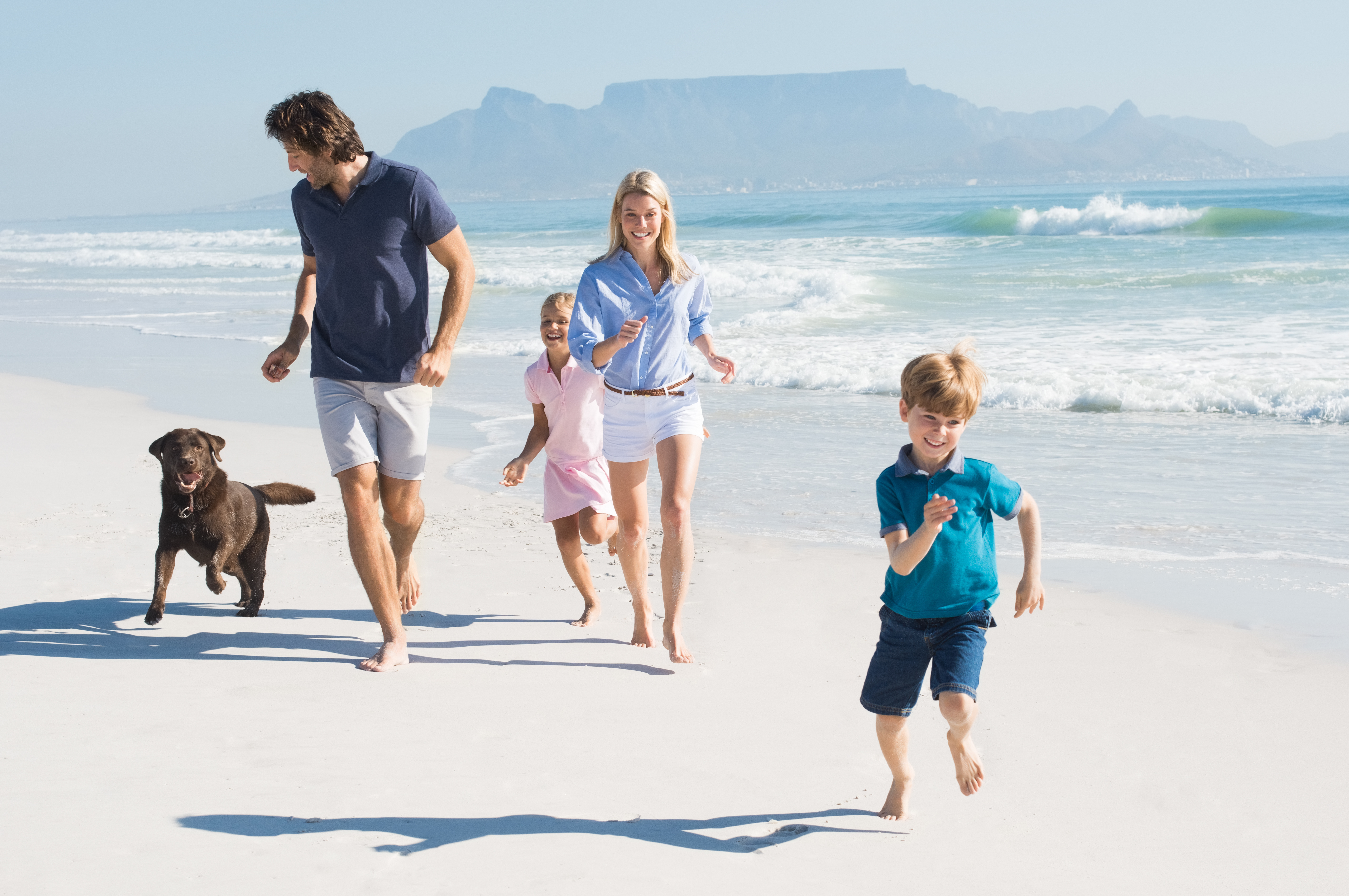 Family Running With Dog