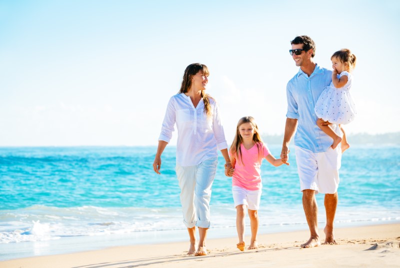 Happy Family On The Beach